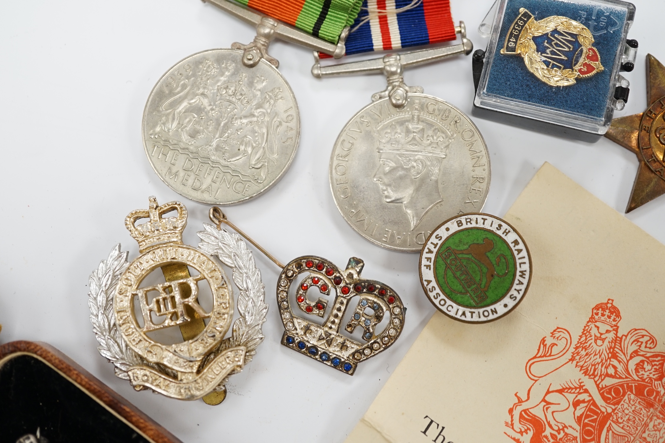 A WWII medal group, comprising of the 1939-1945 War Medal, the Defence Medal, the Africa Star, the Italy Star and the 1939-1945 Star, together with a Royal Artillery sweetheart badge, a cap badge and various other items.